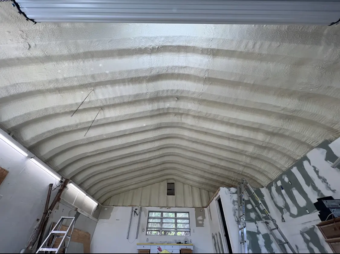 Spray polyurethane foam applied to the underside of a metal roof deck in Redmond